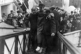 thumbnail: In this 1912 photo made available by the Library of Congress, Harold Bride, surviving wireless operator of the Titanic, with feet bandaged, is carried up the ramp of a ship.