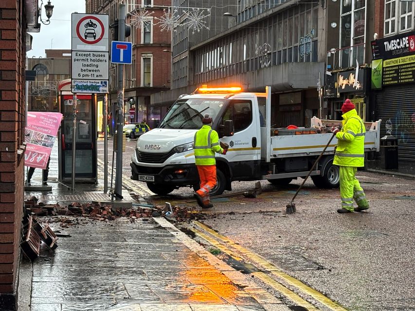 The clean up operation on Castle Street in Belfast city centre (Rebecca Black/PA)