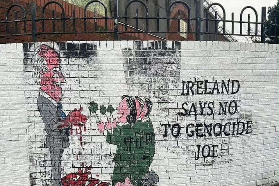 A mural painted over by vandals has been re-painted 