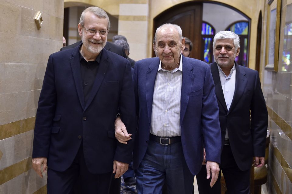 Nabih Berri, centre, walks with Ali Larijani, an adviser to Iran’s supreme leader Ali Khamenei (Hassan Ibrahim/Lebanese Parliament media office/AP)