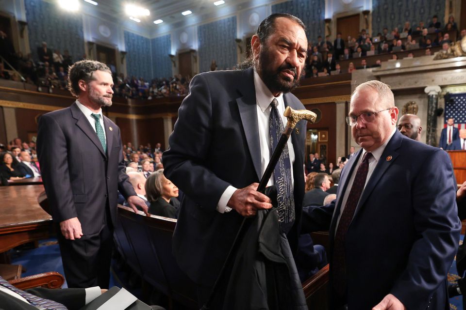 Democrat Representative Al Green is removed from the chamber as Donald Trump speaks (Win McNamee/Pool Photo/AP)