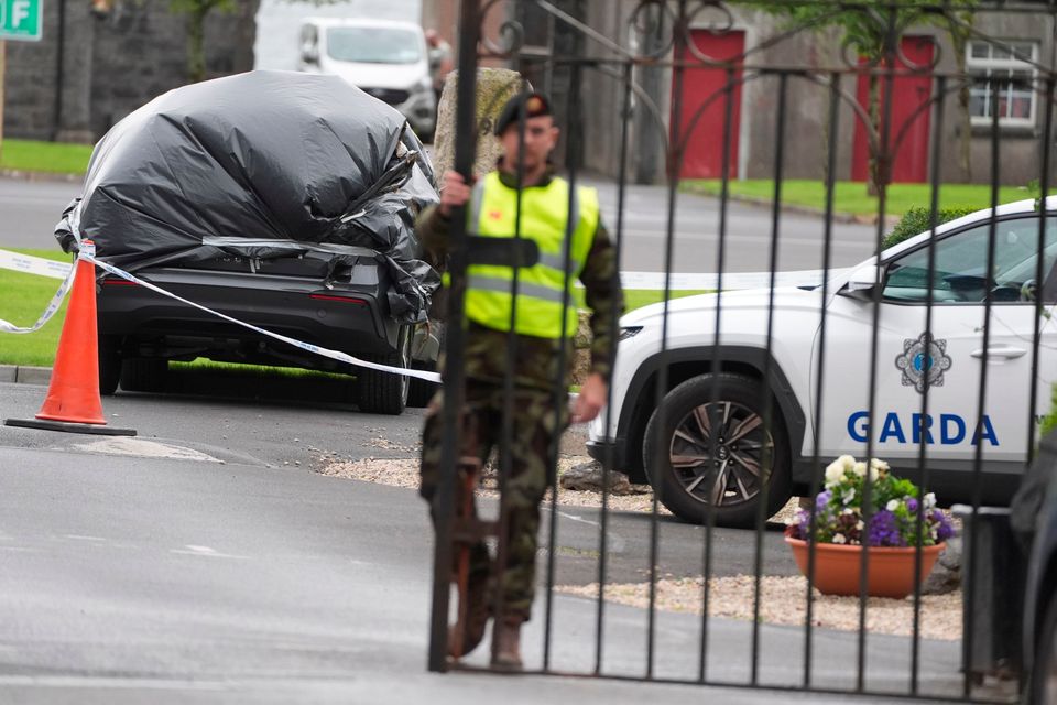 A car wrapped in plastic at the scene of the attack at Renmore Barracks in Galway. Photo: PA