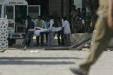 thumbnail: Rescue and security personnel carry a body from the Taj Hotel in Mumbai, India, Thursday, Nov. 27, 2008. Teams of gunmen stormed luxury hotels, a popular restaurant, hospitals and a crowded train station in coordinated attacks across India's financial capital, killing at least 101 people, taking Westerners hostage and leaving parts of the city under siege Thursday, police said. A group of suspected Muslim militants claimed responsibility. (AP Photo/Rajanish Kakade)