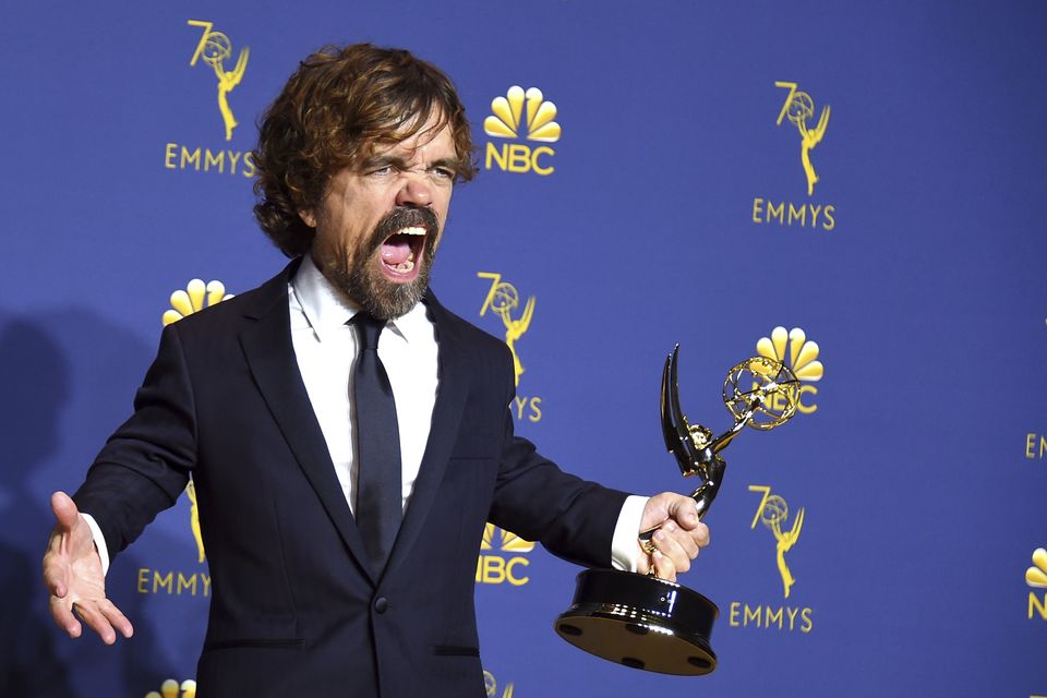 Peter Dinklage poses in the press room with the award for outstanding supporting actor in a drama series for “Game of Thrones” at the 70th Primetime Emmy Awards on Monday, Sept. 17, 2018, at the Microsoft Theater in Los Angeles. (Photo by Jordan Strauss/Invision/AP)