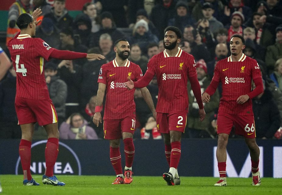 Mohamed Salah celebrates after scoring Liverpool’s third goal against Leicester (Peter Byrne/PA)