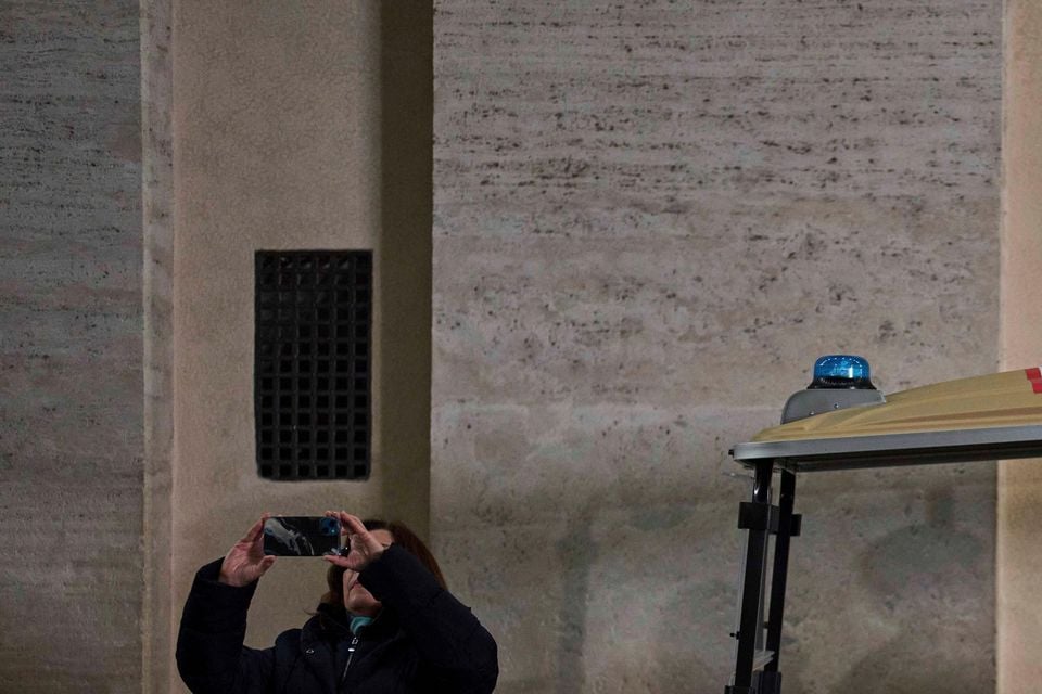 Catholic worshippers attend a nightly rosary prayer service for Pope Francis in St Peter’s Square (Francisco Seco/AP)