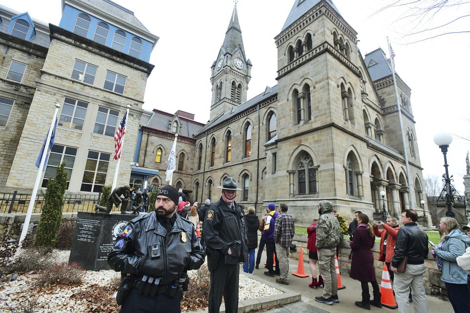 State troopers and police officers stand guard outside of the Blair County Courthouse ahead of an appearance by shooting suspect Luigi Mangione (Thomas Slusser/The Tribune-Democrat via AP)