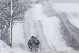 thumbnail: Walkers trudge through the Snow on the Outskirts of Armoy in Northern Ireland. Photo Colm Lenaghan/Pacemaker Press