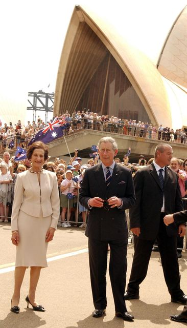 The Prince of Wales walks with Professor Marie Bashir AC, the governor of New South Wales, outside the Sydney Opera House in 2005 (John Stillwell/PA)