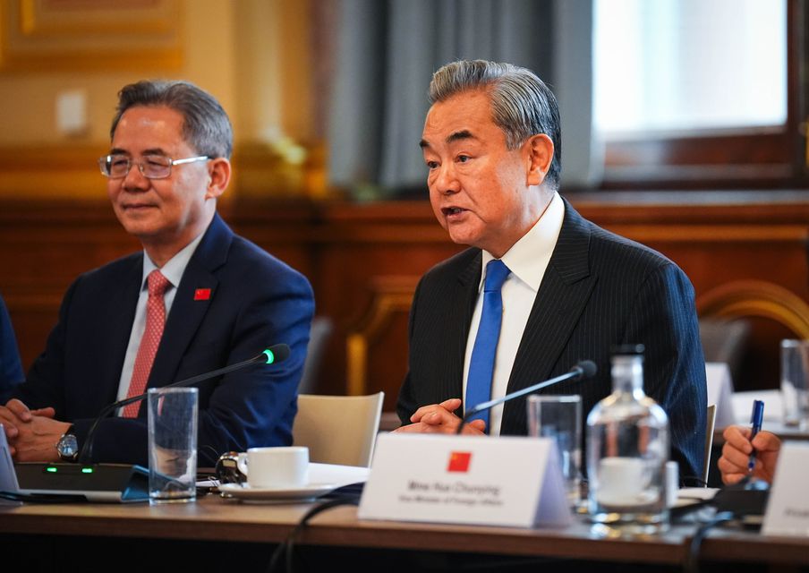 Wang Yi, right, also met UK national security adviser Jonathan Powell (James Manning/PA)