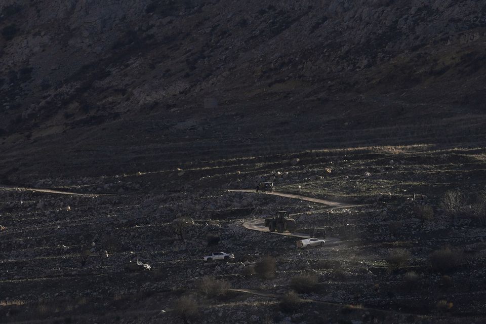 An Israeli bulldozer on the buffer zone near the so-called Alpha Line that separates the Israeli-controlled Golan Heights from Syria (Matias Delacroix/AP)