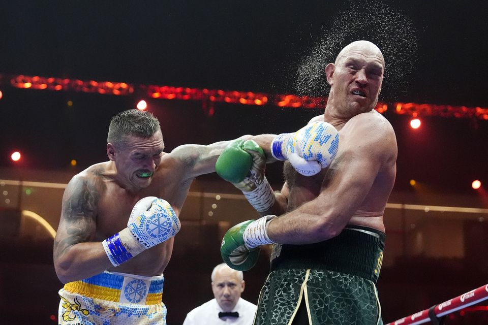 Oleksandr Usyk (left) won the first fight on a split decision (Nick Potts/PA)