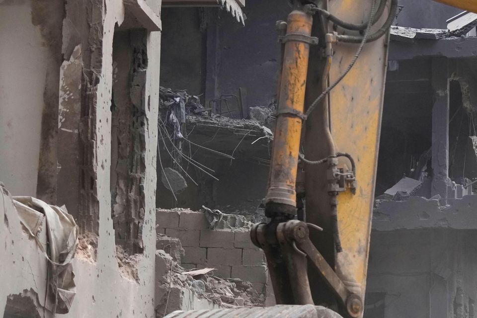 Rescue workers searching for victims at the site of an Israeli air strike in Beirut, Lebanon (Hassan Ammar/AP)