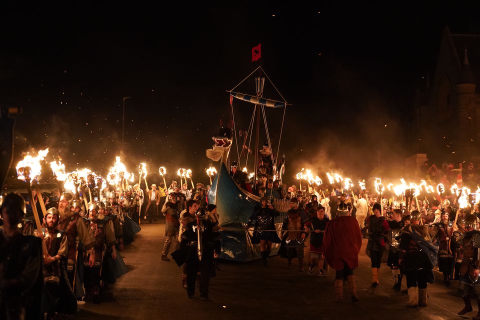 The Jarl Squad set light to a galley in Lerwick on the Shetland Isles during the Up Helly Aa fire festival at the end of January (Andrew Milligan/PA)