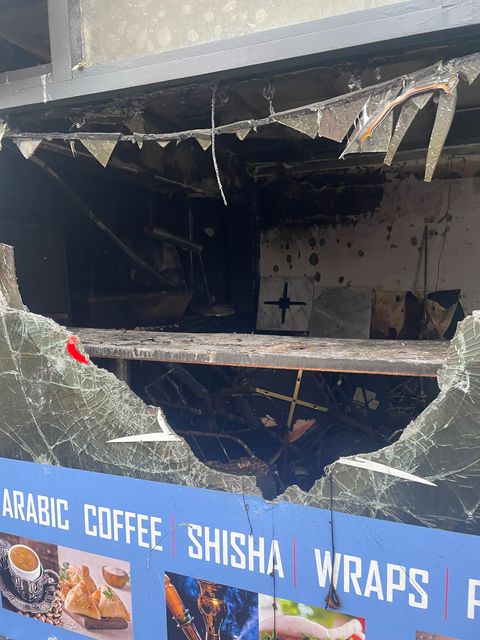 Damage caused to a cafe on the Donegall Road (Jonathan McCambridge/PA)