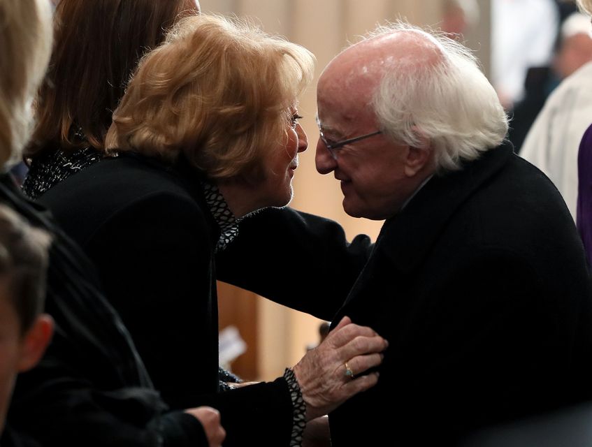 President Michael D Higgins greets Kathleen Watkins at Gay Byrne’s funeral (Brian Lawless/PA)