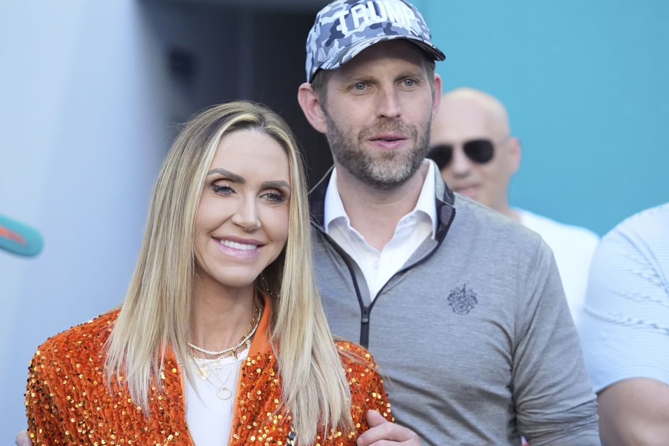 Eric and Lara Trump watch the second half of an NFL football game between the Miami Dolphins and the New England Patriots (AP)