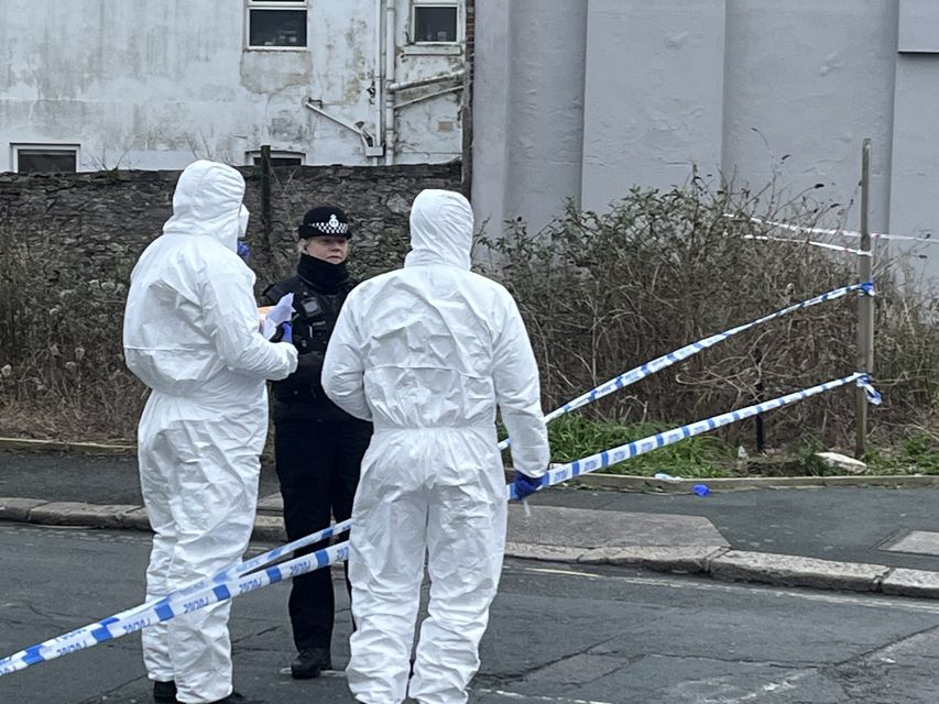 Forensic officers investigate at the scene in Plymouth, Devon (Rod Minchin/PA)