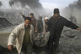 thumbnail: Palestinians carry the body of a Palestinian killed in an Israeli missile strike in Rafah, southern Gaza Strip, Saturday, Dec. 27, 2008. Israeli warplanes demolished dozens of Hamas security compounds across Gaza on Saturday in unprecedented waves of simultaneous air strikes. Gaza medics said more than 120 people were killed and more than 250 wounded. (AP Photo/Hatem Omar)