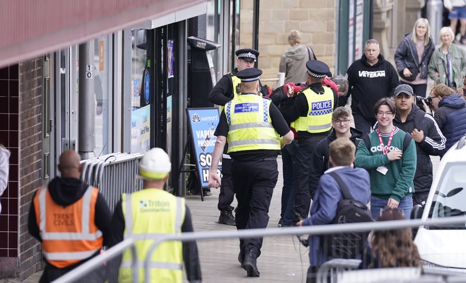 The man was hauled to the ground by police (Danny Lawson/PA)