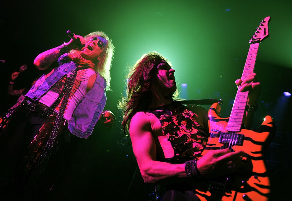 Singer Michael Starr and musician Satchel of Steel Panther perform at Irving Plaza on January 4, 2012 in New York City.  (Photo by Stephen Lovekin/Getty Images)
