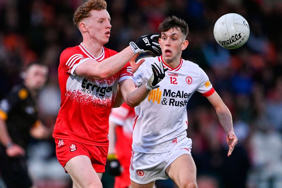 Niall O'Donnell of Derry in action against Gavin Potter of Tyrone