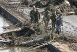 thumbnail: SENDAI, JAPAN - MARCH 14:  Members of the Ground Self-Defense Forces help a man evacuate the area when a warning of tsunami is issued after a 9.0 magnitude strong earthquake struck on March 11 off the coast of north-eastern Japan, on March 14, 2011 in Sendai, Japan. The quake struck offshore at 2:46pm local time, triggering a tsunami wave of up to 10 metres which engulfed large parts of north-eastern Japan. The death toll is currently unknown, with fears that the current hundreds dead may well run into thousands.  (Photo by Kiyoshi Ota/Getty Images)