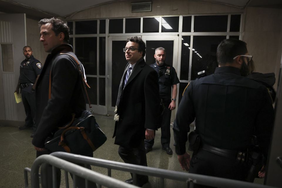 Journalists leave the court after Donald Trump appeared remotely for a sentencing hearing in front of New York State Judge Juan M Merchan (Brendan McDermid/Reuters via AP, Pool)