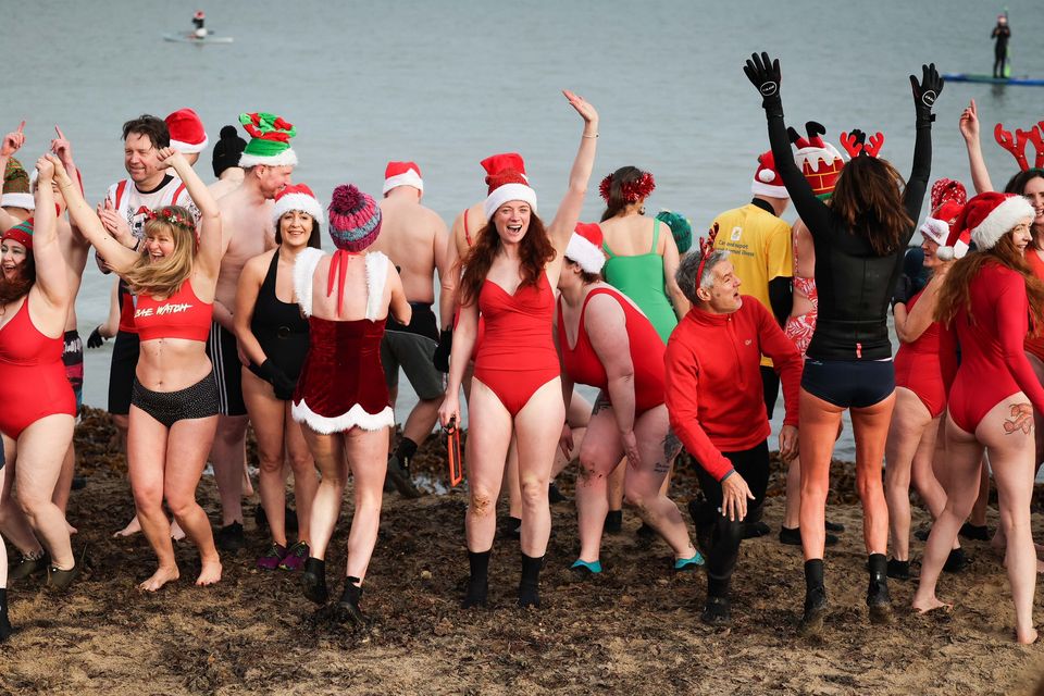 Swimmers from north Down take part in the annual Santa Splash at Helens Bay beach, County Down (Credit: Kelvin Boyes / Press Eye)