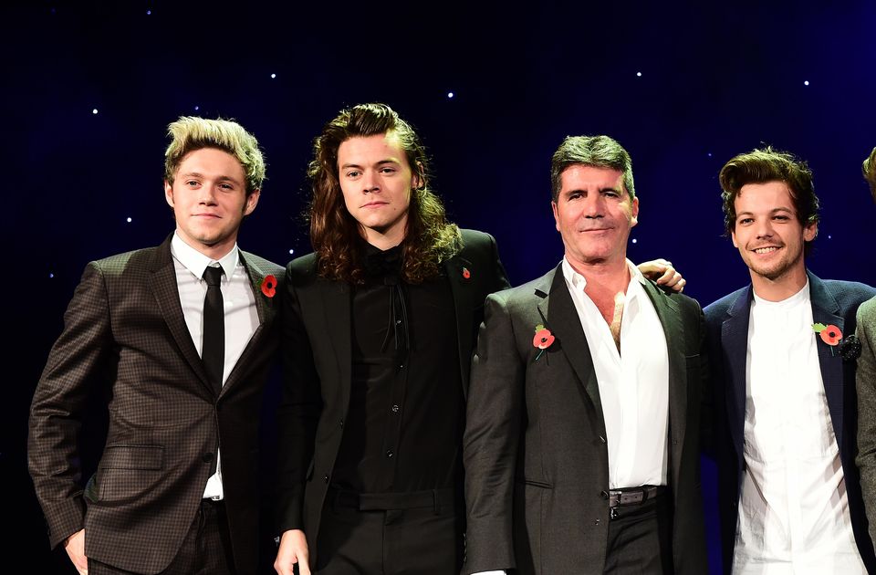 Niall Horan, Harry Styles, Louis Tomlinson and Liam Payne with music mogul Simon Cowell (Dominic Lipinski/PA)