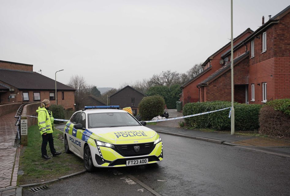 Police at the scene in Talbot Green (Ben Birchall/PA)