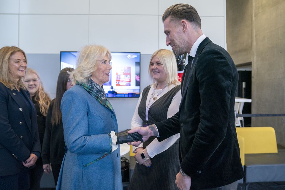 The Queen was introduced to Aberdeen FC defender Angus McDonald, who described the meeting as a ‘real privilege’ (Jane Barlow/PA)