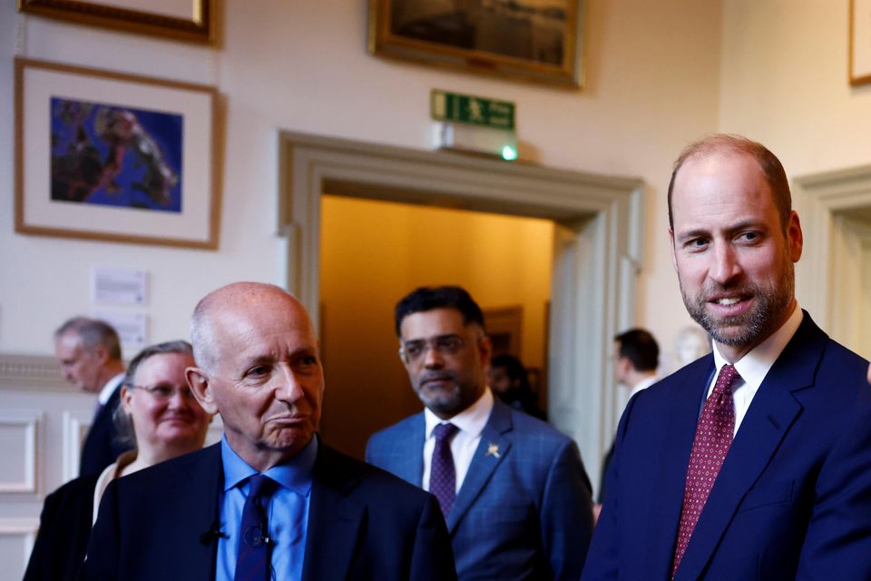 William (centre) and Theyazin bin Haitham listen to British explorer Mark Evans (left) (Benjamin Cremel/PA)