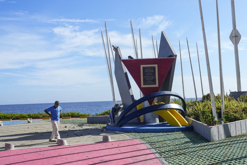 A statue of former President Hugo Chavez is missing from its base the day after opposition protests against the reelection of Chavez’s protege, President Nicolas Maduro (Matias Delacroix/AP)