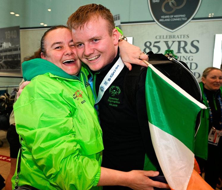 16 March 2025; Mairéad Sheehan celebrates with her son Joseph 'Joe-Joe' Sheehan of Team Ireland, a member of Mallow Special Olympics Club, Doneraile, Cork, who won Bronze in Floorball, on his arrival at Dublin airport after competing in the Turin 2025 Special Olympics World Winter Games in Italy. Photo by Ray McManus/Sportsfile 