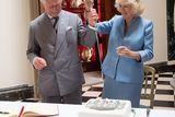 thumbnail: ANTRIM, NORTHERN IRELAND - MAY 22:  Prince Charles, Prince of Wales and Camilla, Duchess of Cornwall cut a cake with the help of Mr David Lindsay, HM Lord-Lieutenant of County Down during their visit to Mount Stewart House and Garden on May 22, 2015 in Newtownards, Northern Ireland. Prince Charles, Prince of Wales and Camilla, Duchess of Cornwall visited Mount Stewart House and Gardens and Northern Ireland's oldest peace and reconciliation centre Corrymeela on the final day of their visit of Ireland.  (Photo by Eddie Mulholland - Pool/Getty Images)