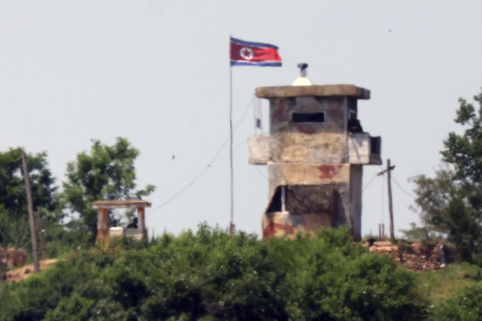 A North Korean flag flutters in the wind at a military guard post seen from Paju, South Korea (File/AP)