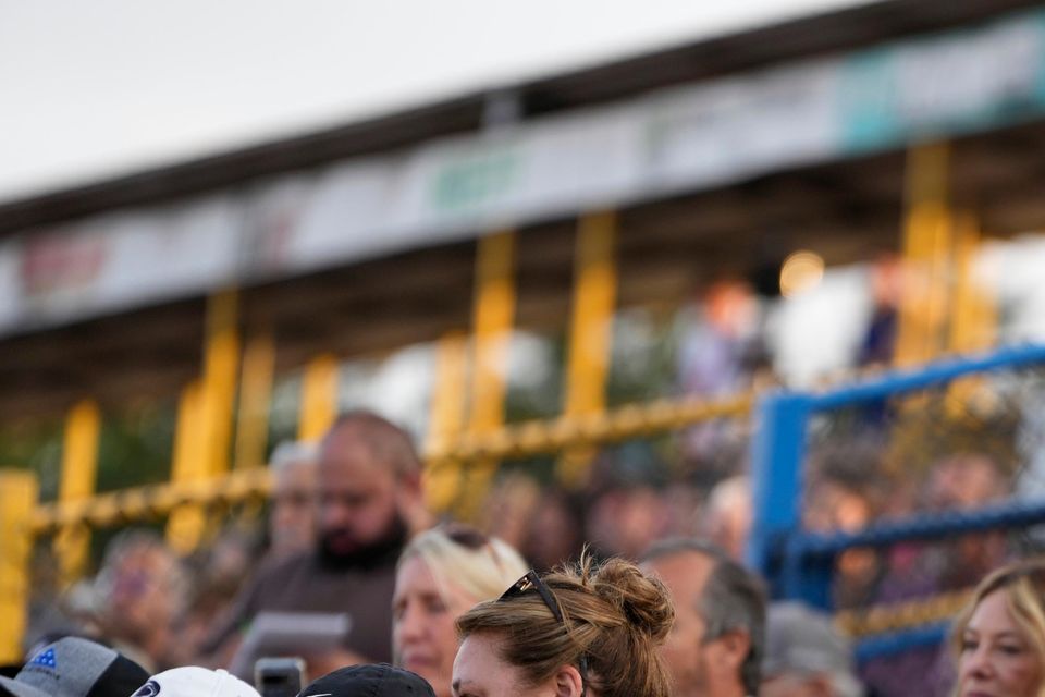 A woman wipes her face during a vigil for Corey Comperatore (Matt Slocum/AP)