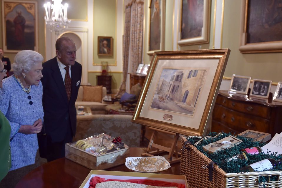 The Queen and Philip in 2015, receiving a painting of Villa Guardamangia, the house in Malta where they stayed as a young married couple (Alan Davidson/PA)