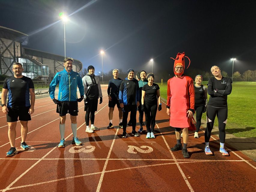 Mr Campbell with members of the triathlon club (Jamie Campbell/PA)