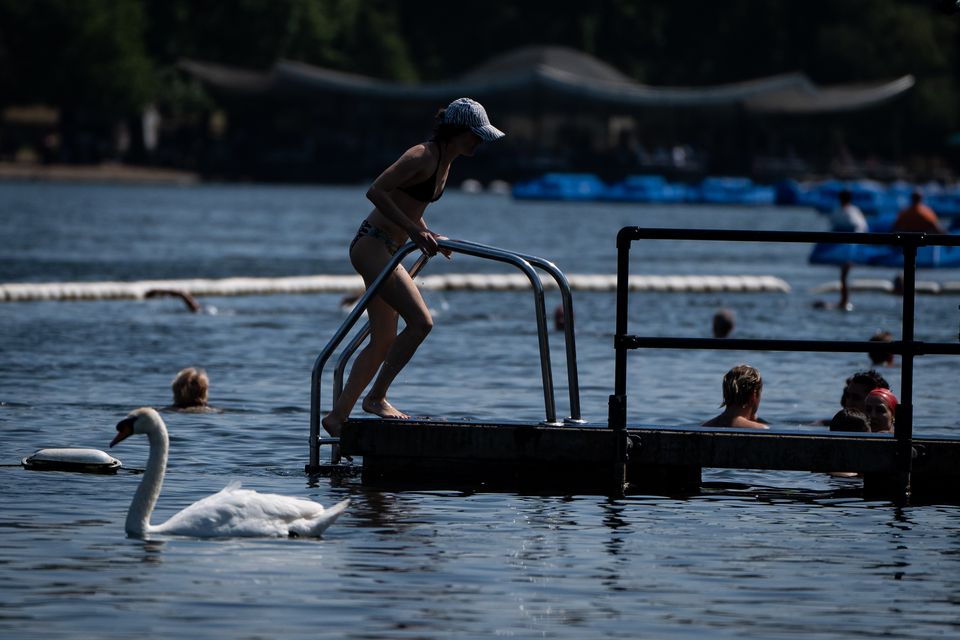 A person enters the water in the Serpentine, London during recent warm weather (Aaron Chown/PA)