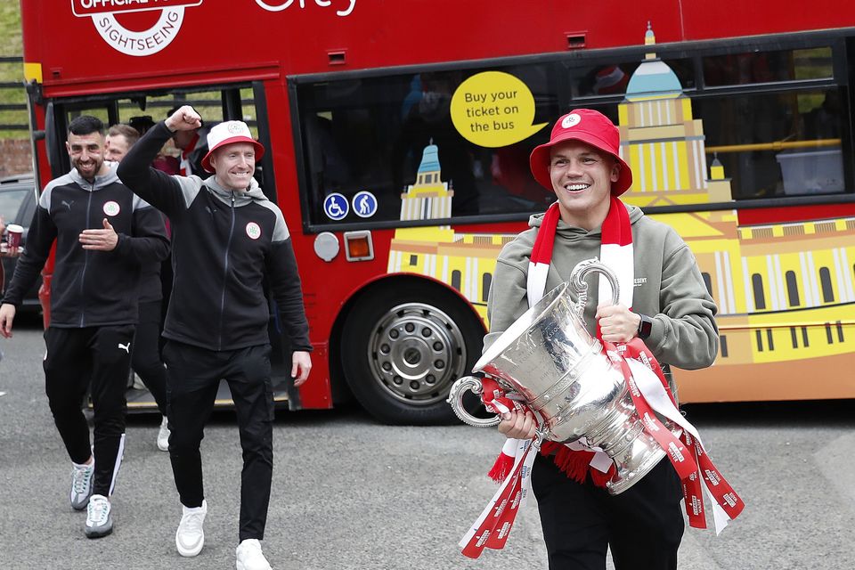 Cliftonville player Rory Hale arrives with the Irish Cup as Cliftonville players arriveed at the Devinish bar on an open top bus to meet supporters, Monday, May 6, 2024.  Picture by Peter Morrison
