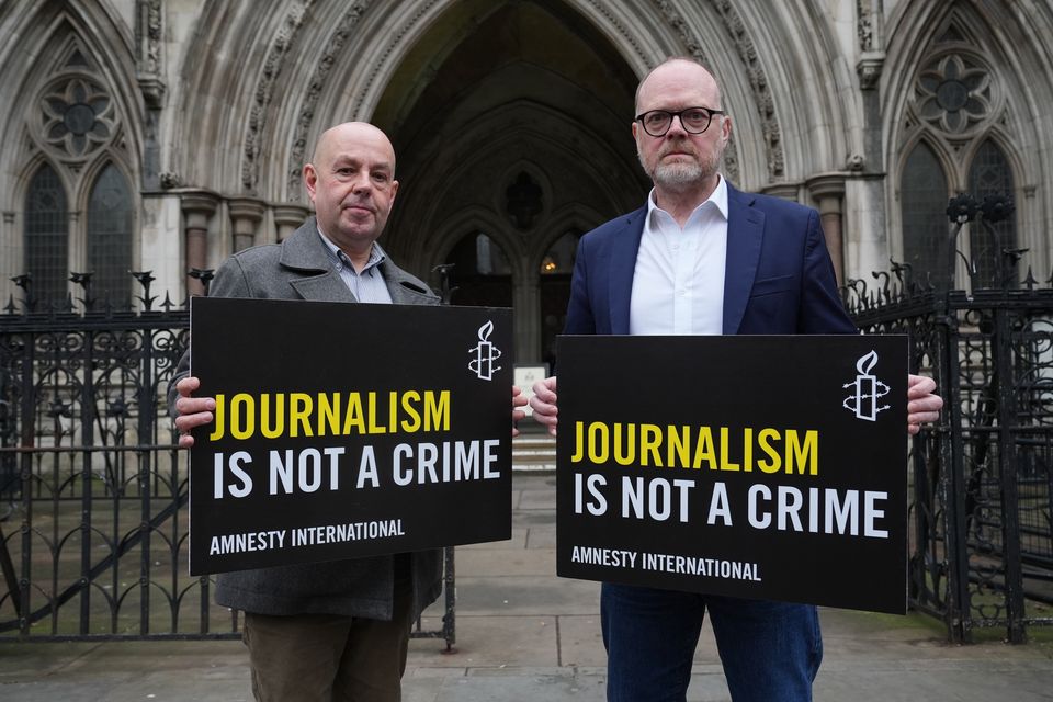 Journalists Barry McCaffrey (left) and Trevor Birney, outside the Royal Courts of Justice, in London on Tuesday (PA)