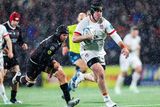 thumbnail: Ulster’s Scott Wilson moves forward with the ball during their clash against the Lions