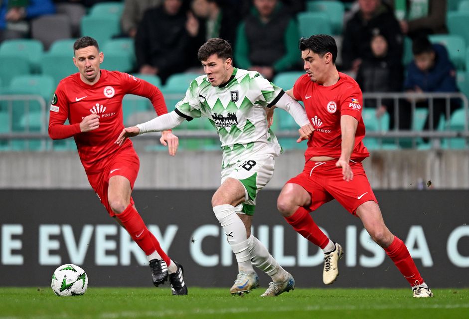 Mark Randall (left) and Shaun Want with Marko Brest of NK Olimpija Ljubljana