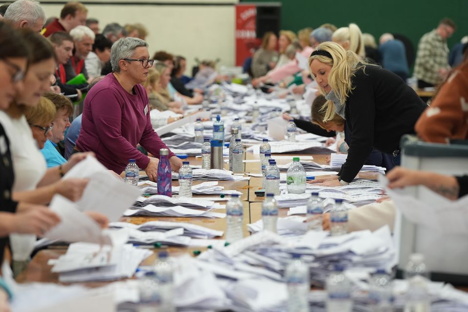 Counting takes place at Nemo Rangers GAA Club in Cork after voters went to the polls to elect 174 TDs across 43 constituencies (Jacob King/PA)