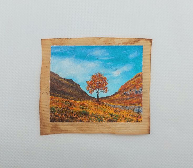 The Sycamore Gap tree painted during autumn on a used tea bag (Caroline West/PA)