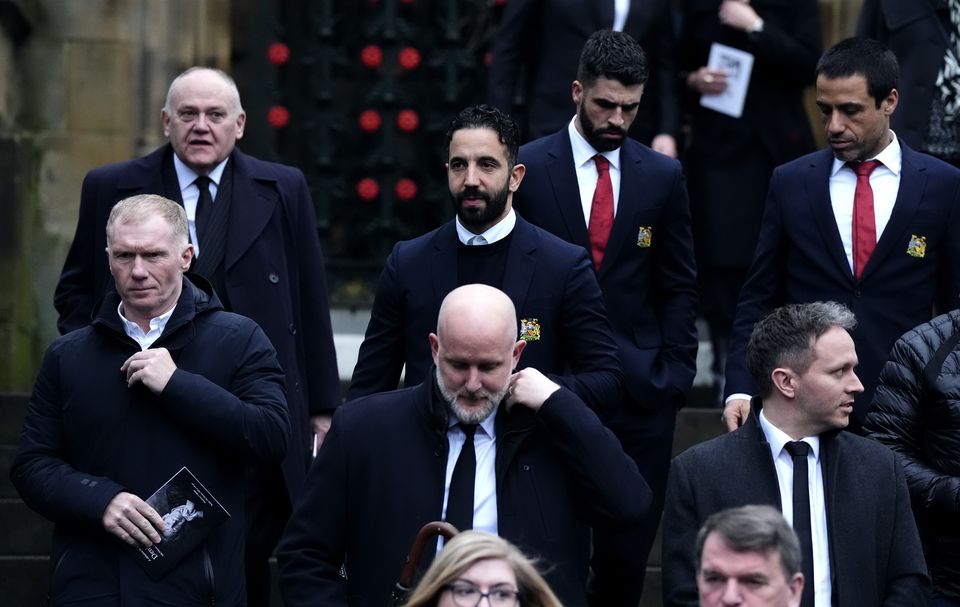 Mourners including Paul Scholes, left, and Ruben Amorim, centre, leave Manchester Cathedral following the funeral (Nick Potts/PA)