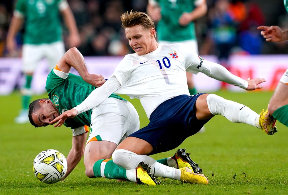 Martin Odegaard, right, damaged ankle ligaments while on duty for Norway in August (Brian Lawless/PA)