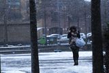 thumbnail: People make their way to work as snow falls over Belfast.
Picture Colm O'Reilly